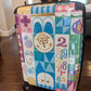 White Iconic Animals of It's a Small World Suitcase Carry On Luggage